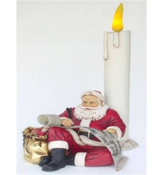 SANTA CLAUS SITTING WITH CANDLE