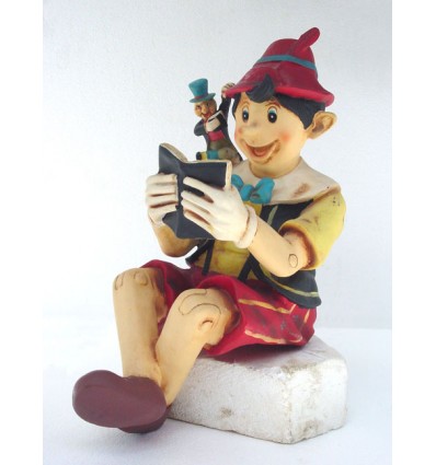 BOY SITTING  W/ BOOK